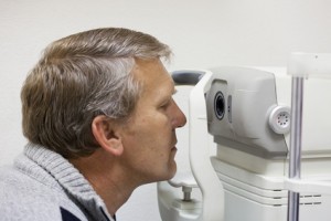 mature man checks sight on the special device